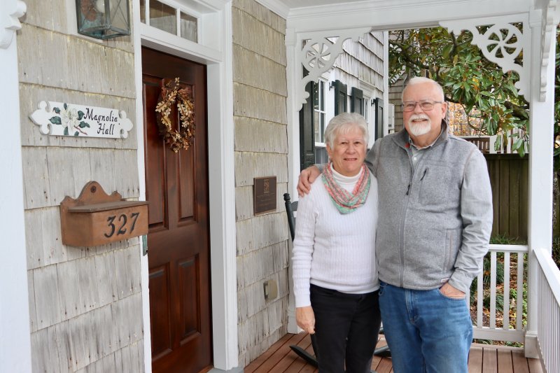 Kevin and Marion Moore on the front porch of Magnolia Hall, their restored home in Lewes’ historic district. They named it Magnolia Hall after the large magnolia trees on the property. BILL SHULL PHOTO